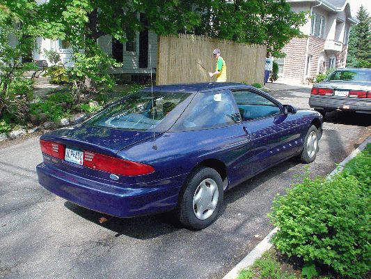 My new car behind the old Chevy Cavelier
